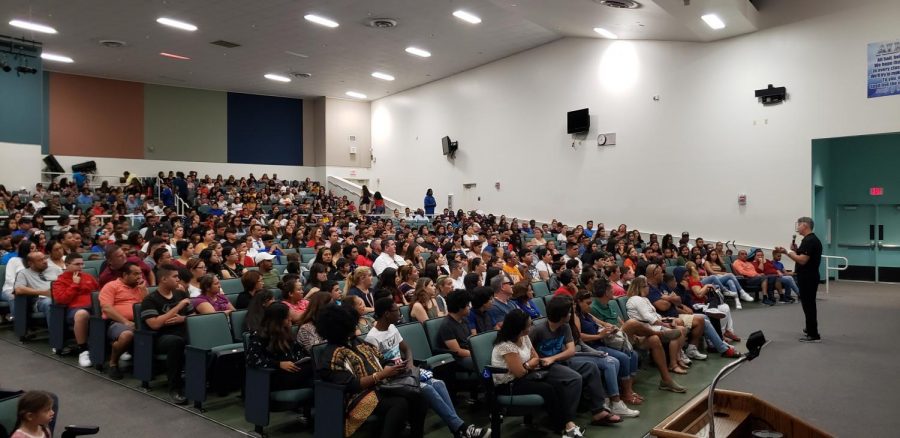 Principal JC DeArmas addresses the crowd at the New Student Orientation on August 17, 2019. With over 1000 attendees, it was the largest orientation in South Dade history.