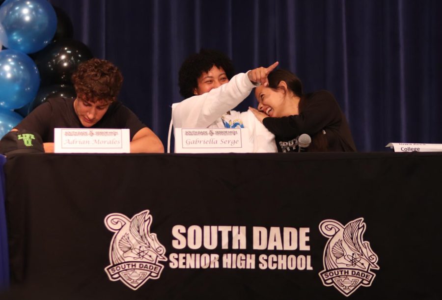 Current and future teammates Gabriella Segre and Sara Arrojo share a laugh during signing day. 