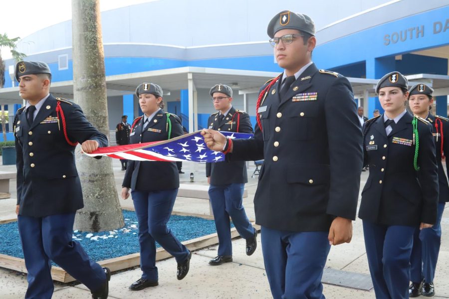 JROTC+Cadets+Deliver+the+Flag+to+be+raised+then+lowered+to+half+staff+in+remembrance+of+9%2F11%2F01