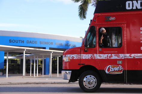 The New Raising Canes Location opening in Homestead brought their food truck to South Dade to surprise the members of the band program.