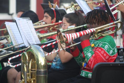 Junior Lakeem Davis plays the trombone, festively wrapped in white and red tape to resemble a candy cane for the occasion.