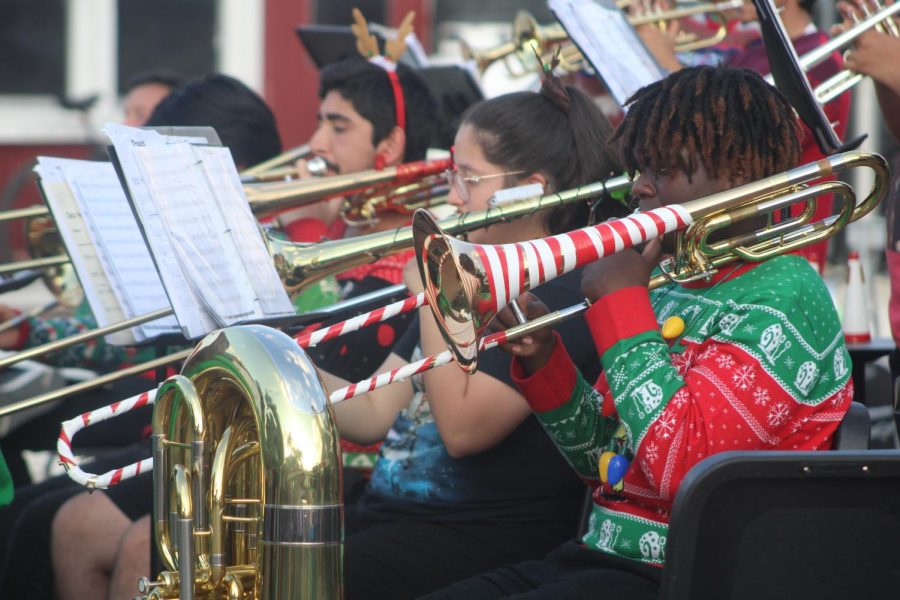 Junior+Lakeem+Davis+plays+the+trombone%2C+festively+wrapped+in+white+and+red+tape+to+resemble+a+candy+cane+for+the+occasion.