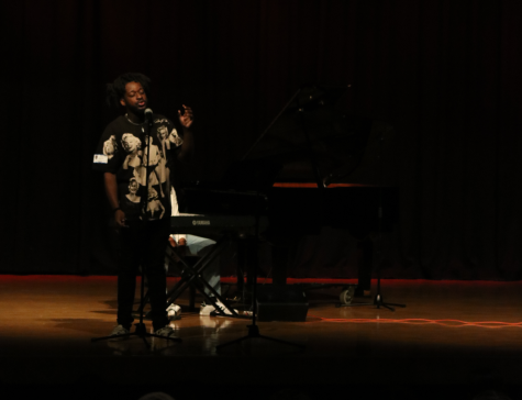 Poet Eveul Evo Exil performs some of his poetry when Piano Slam visited South Dade