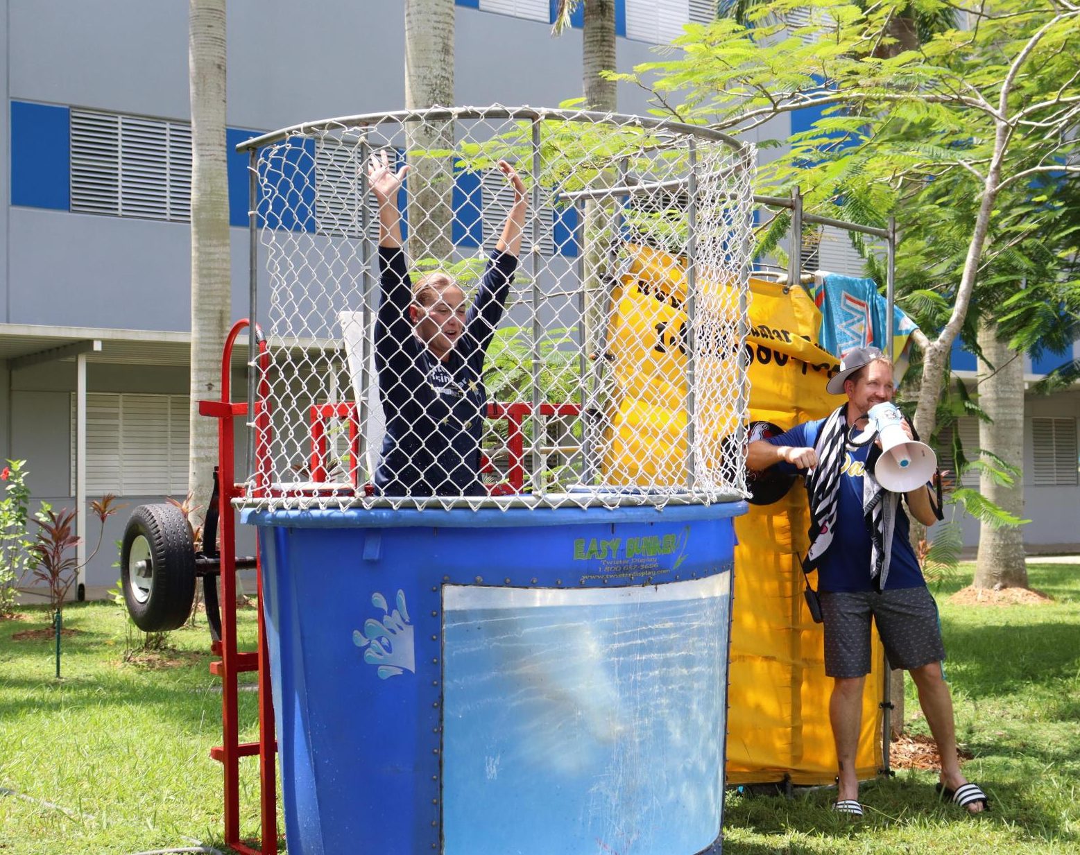 New Assistant Principal Vivian Lugo is dunked by fellow AP John Crary as her unofficial welcome to the South Dade Family during Homestead week. 