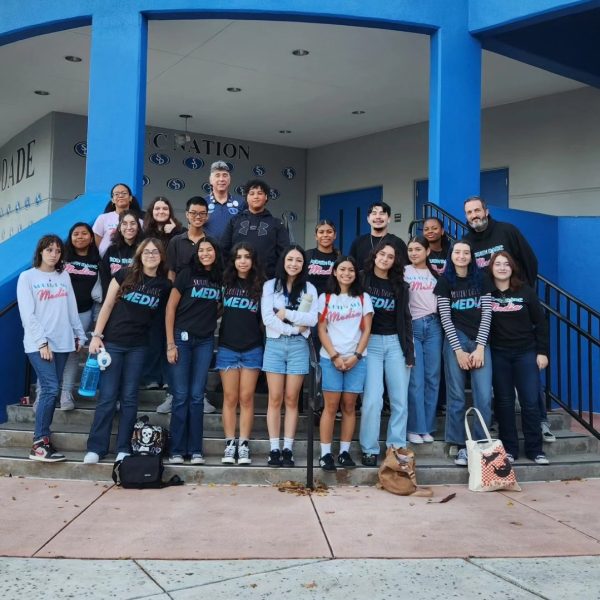 The South Dade Media team take a picture with Principal J.C. De Armas before boarding the bus to Journalism Day at Miami Dade College Kendall