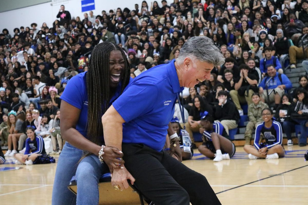 During one of the pep rallies, Athletic Director and Principal J.C. De Armas battled in the final round of musical chairs.