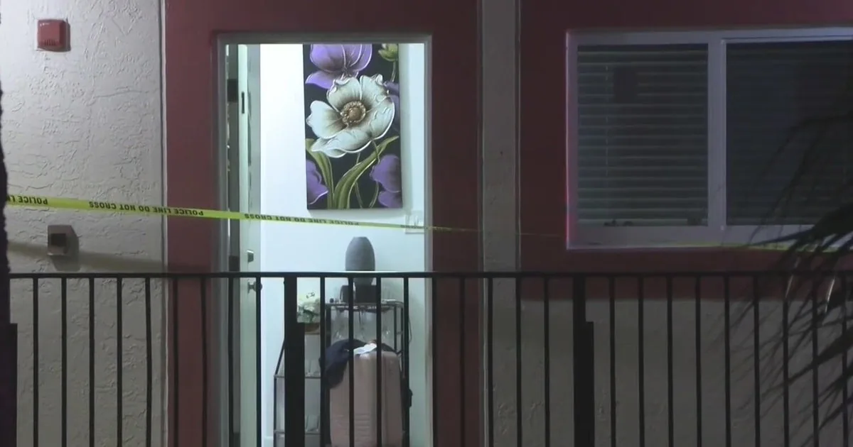Police and emergency crews respond outside a Hialeah apartment complex after a shooting